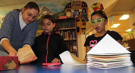 &lt;p&gt;Library Director Michelle Fenger, left, helps&#160; Francheska, 11 of Ronan, and Alana, 11, of Pablo, put some gift bags together. &#145;Alana&#146;s been such a great help to the library,&#146; Fenger said.&lt;/p&gt;