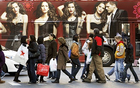 &lt;p&gt;Shoppers walk in front of a tour bus with an Express clothing store ad on the side Friday in Chicago. Nationwide, early signs pointed to a solid turnout for the traditional start to the holiday shopping season. In an encouraging sign for retailers and for the economy, more shoppers appeared to be buying for themselves than last year, when such indulgences were limited.&lt;/p&gt;