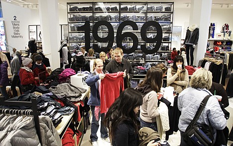&lt;p&gt;Shoppers look for purchases in a Gap store in downtown Seattle on Friday.&lt;/p&gt;