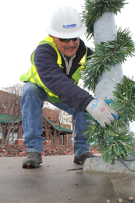 &lt;p&gt;Charlie Pluff drove the truck and wrapped the poles with tinsel. &#147;We&#146;re just trying to get into the holiday spirit,&#148; Pluff said. &#147;This is easy. Usually it&#146;s 20 degrees by now.&quot;&lt;/p&gt;