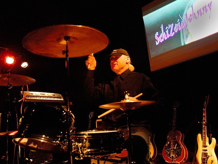 Schizoid Johnny, stage persona of Swan River School music teacher John Steinhardt, plays a drum solo at the start of his concert for fifth- through eighth-graders at the school Tuesday morning. See more pictures and hear Johnny play in an audio slideshow at www.dailyinterlake.com