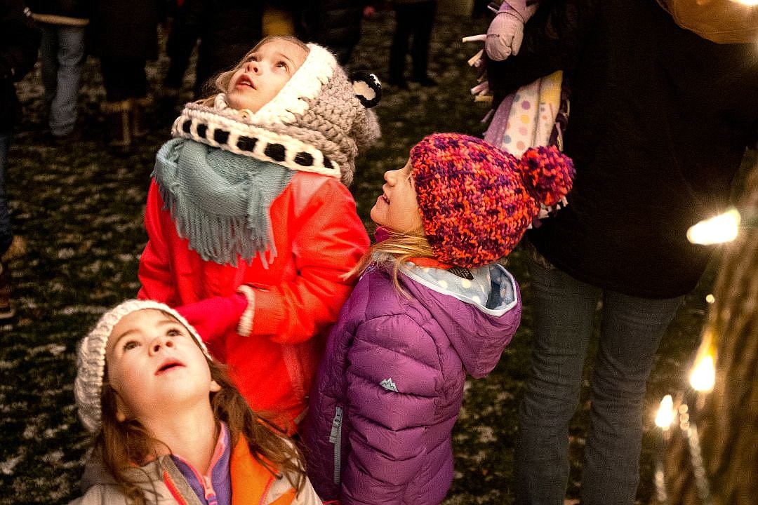 &lt;p&gt;From top to bottom, Avery Green, 8, Lily Havercroft, 5, and Emery Havercroft, 3, gaze up into a tree adorned with thousands of lights after it was lit up following the firework show on Friday at the 29th Annual Coeur d'Alene Resort Holiday Light Show.&lt;/p&gt;