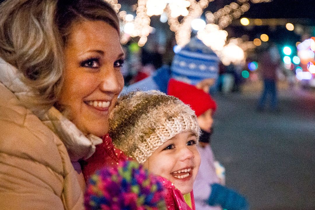 &lt;p&gt;Halle Hatfield, 3, and her mother, Drue, smile as they watch the holiday &quot;Cool Yule&quot; parade floats move down Sherman Avenue on Friday in Coeur d'Alene before the Coeur d'Alene Resort Holiday Light Show.&lt;/p&gt;