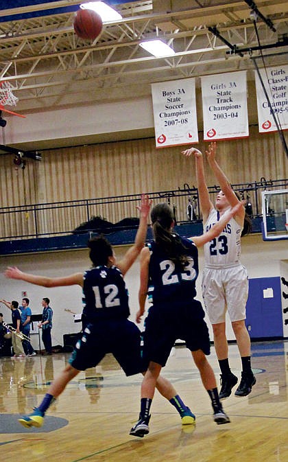 &lt;p&gt;Senior Jasmine Hill, fresh off a volleyball trip to state takes an outside shot against Lake City defenders Nov. 20.&lt;/p&gt;