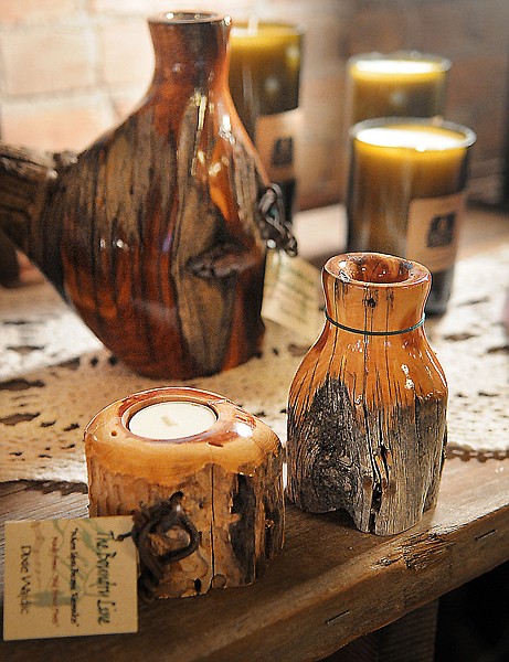 The Boundry Line by artist Dixie Wajdic is one of the collections available at the Think Local Christmas store in downtown Kalispell. Items in this collection include candle holders, vases and other wooden items made from old fence posts.