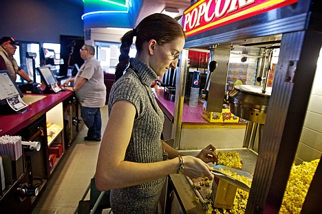 &lt;p&gt;BreAnna Mader prepares popcorn for matinee customers Monday at the Post Falls Theater. The movie house is converting from a &quot;first-run&quot; cinema to a discount theater on Friday, lowering prices from $7-9 to $2 on all days (adults and youth) with the exception of $1 on Wednesdays.&lt;/p&gt;