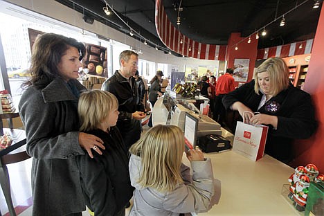 &lt;p&gt;Genny Ryan and her children Jack Ryan, 11, and Tess Ryan, 8, from Charlotte, N.C., purchase Fannie May Candy at the Fannie May store on Michigan Ave. in Chicago on Tuesday. Six years ago, Fannie May, famous for its mint meltaways and vanilla buttercreams, was all but finished. The Midwest mainstay opened in 1920 was in bankruptcy, and more than 200 retail stores were closed. But in the years since the 2004 near-meltdown, Fannie May has seen a turnaround and is thriving thanks to what executives say has been a mix of old and new, a strict adherence to decades-old chocolate recipes and growth in online and retail sales.&lt;/p&gt;