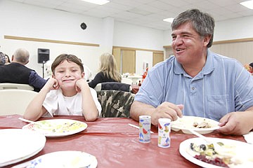 &lt;p&gt;Patrick Hemline, age 6, finishes up Thanksgiving dinner with his grandpa, Vernon Christopher.&lt;/p&gt;