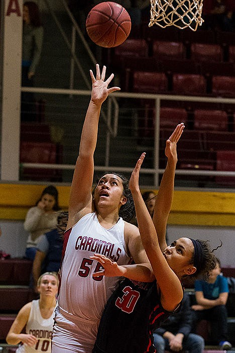 <p>North Idaho Colleges Pansies Taimani goes up over Casper Colleges Gabby Johnson for a basket in the second half.</p>