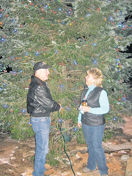 &lt;p&gt;Teri Noble, co-owner of Noble Excavating, accompanies Mayor Doug
Roll as the tree is lighted. The Nobles contributed $2,000 for
Mineral Avenue decorations.&lt;/p&gt;