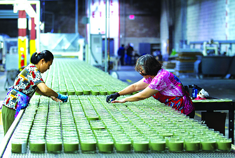 &lt;p&gt;In this Aug. 30, 2012 file photo, production line workers, Xiao Yins-Wong, left, and Chui M. Wong, straighten the wick in the candles at Chesapeake Bay Candle factory in Glen Burnie Md. The U.S. economy grew at a 2.7 percent annual rate from July through September, much faster than first thought. The strength is expected to fade in the final months of the year because of uncertainty about looming tax increases and government spending cuts.&lt;/p&gt;