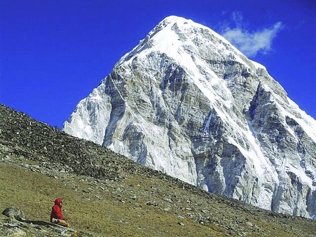 &lt;p&gt;Stemborski is dwarfed by the Himalayan range behind him at a Mt. Everest base camp.&lt;/p&gt;