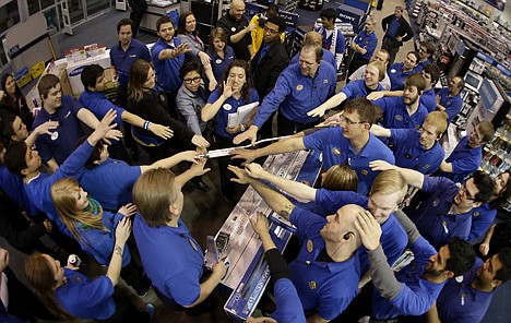 &lt;p&gt;Best Buy employees rally after a pep talk as they prepare to open the store to shoppers Thursday in Overland Park, Kan. Instead of waiting for Black Friday, which is typically the year's biggest shopping day, more than a dozen major retailers are opening on Thanksgiving this year.&lt;/p&gt;