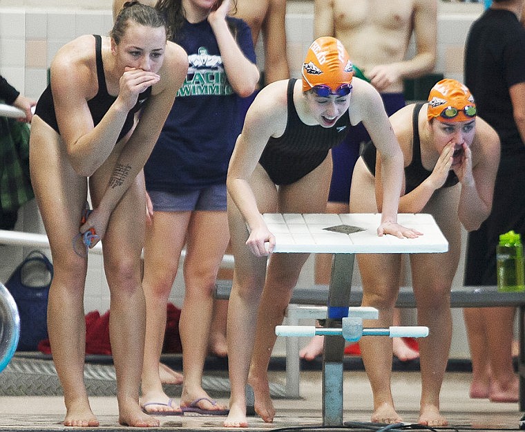 &lt;p&gt;From left, Flathead's Cassie Krueger, McKenzie Lane and Sara Jensen cheer on teammate Maggie Mulcahy as she finishes the last leg of the 200-yard medley relay Saturday afternoon during the Kalispell Invitational swim meet at The Summit.&#160;&lt;/p&gt;
