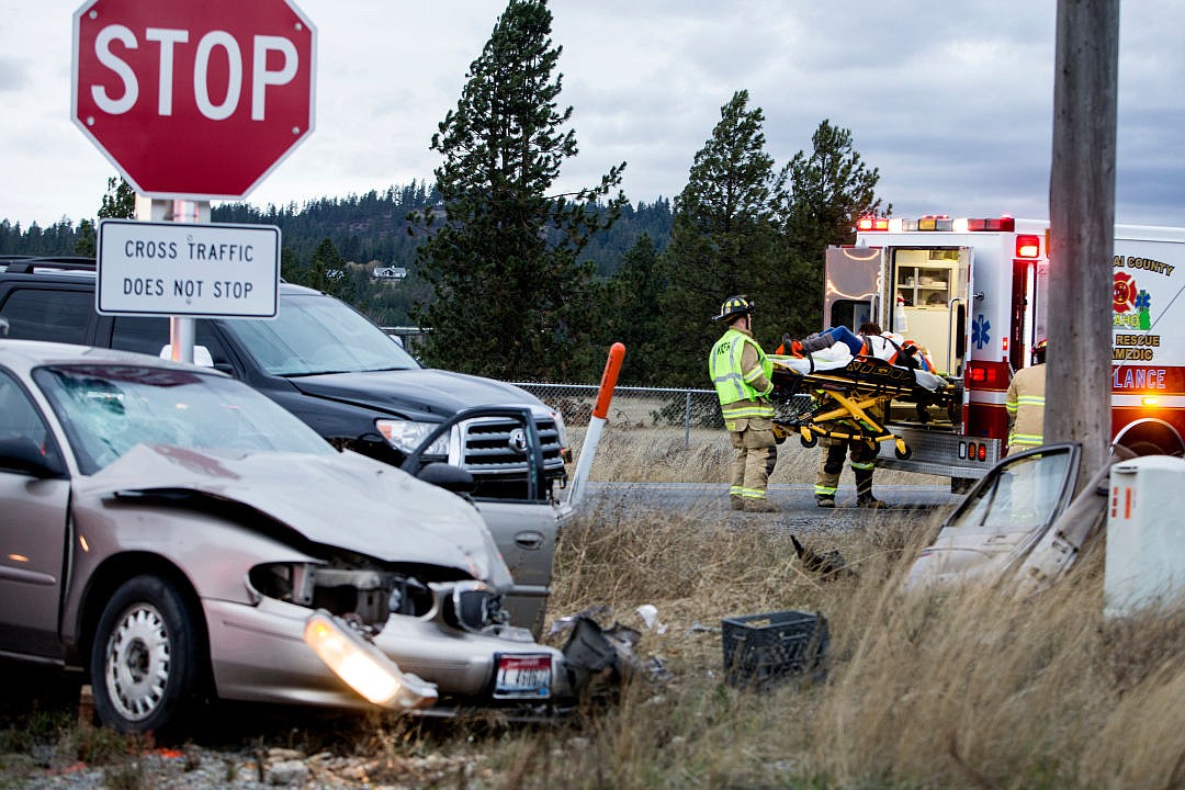 &lt;p&gt;A woman is lifted into a Kootenai County Fire and Rescue ambulance after sustaining injuries in a two-car collision on Friday at the intersection of Prairie Avenue and Pleasant View Road in Post Falls. This is the fourth accident at the intersection this month, says a sheriffs deputy. An eyewitness says the tan sedan was traveling eastbound on Prairie Avenue, stopped at the stop sign, and continued into the intersection before being struck on the driver's side front end by the blue sports utility vehicle that was traveling southbound on Pleasant View Road. The cause of the accident is currently under investigation.&lt;/p&gt;