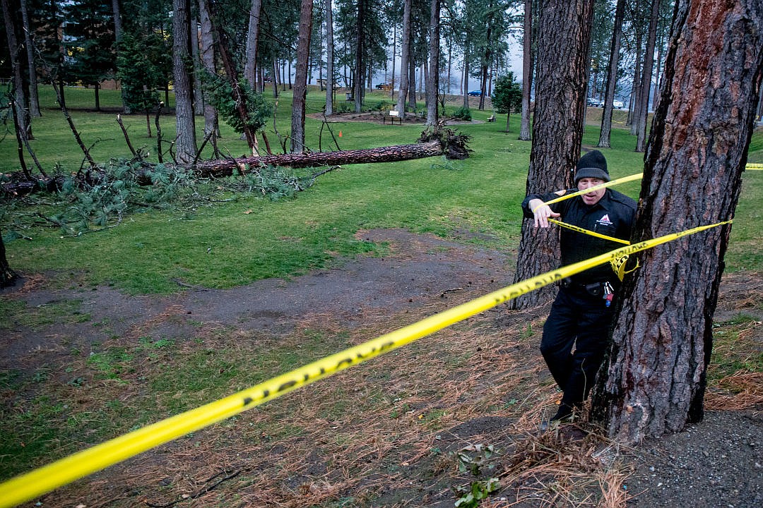 &lt;p&gt;North Idaho College Security Officer Stuart Wagner uses caution tape to set up a perimeter around an area behind the Children's Center on North Idaho College's campus, where a tree was felled by strong winds on Tuesday. The Children's Center was evacuated before the tree fell, and the rest of campus was closed beginning at 4 p.m.&lt;/p&gt;