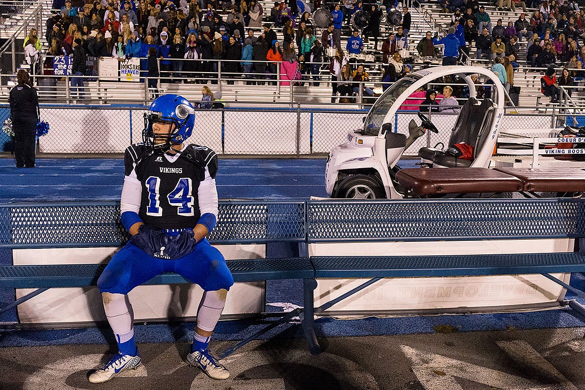 &lt;p&gt;Coeur d&#146;Alene High School quarterback Austin Lee takes a break on the bench as the defense plays against Madison High School during Friday&#146;s state 5A playoff game.&lt;/p&gt;