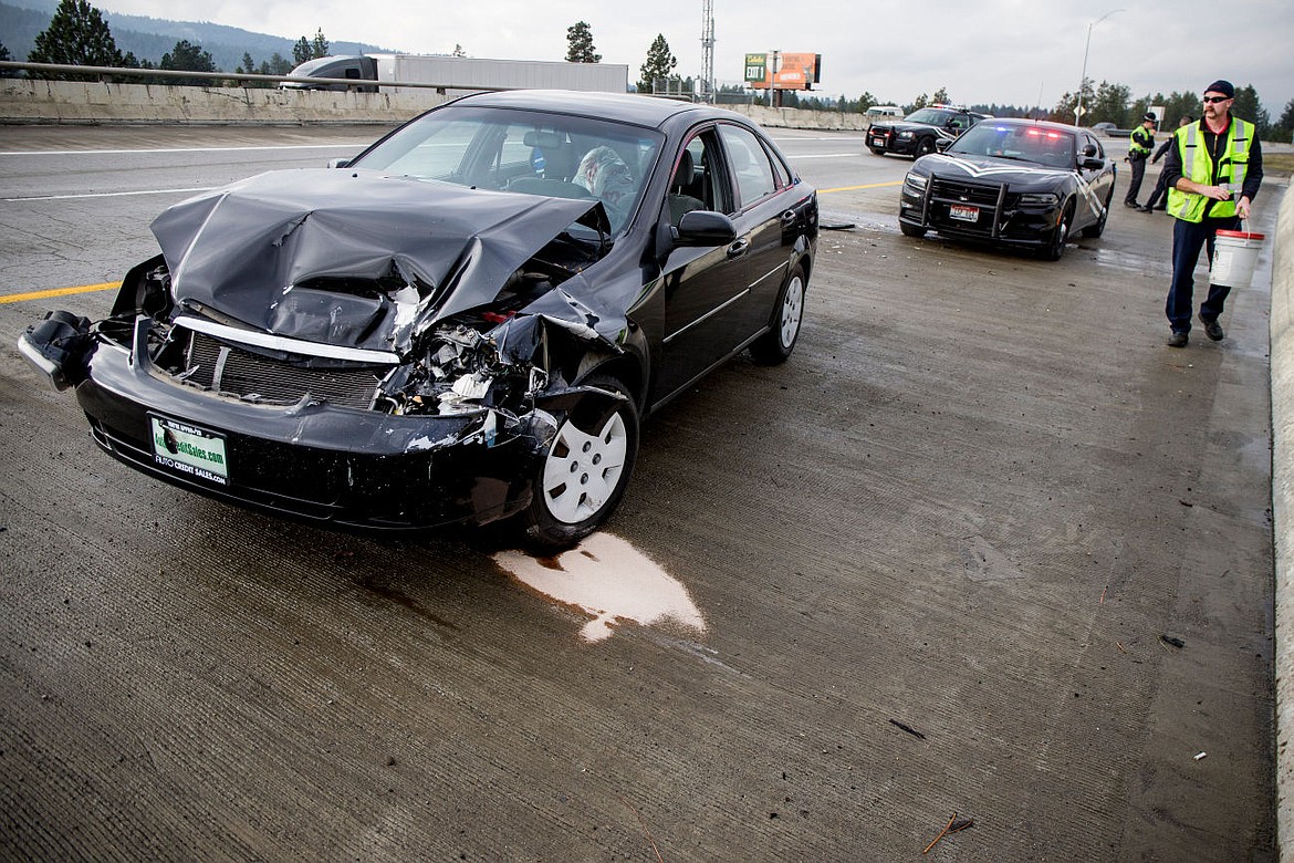 &lt;p&gt;A sedan rests on the shoulder of Interstate 5 Easbound after it was involved in a two-vehicle rear-ending accident Friday morning near the Spokane Street exit in Post Falls. Minor injuries were treated on scene.&lt;/p&gt;