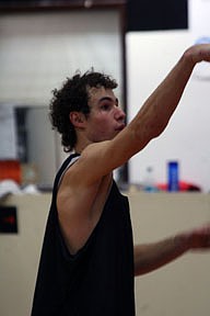 Tanner Ostrum holds his follow through after shooting a free-throw at practice.