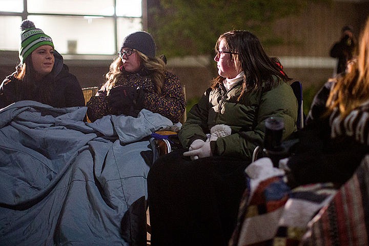 &lt;p&gt;TESS FREEMAN/Press&lt;/p&gt;&lt;p&gt;From left: Post Falls seniors Caitlin Judge, Zoe Reed&#160;and Jessicah Bruner try to keep warm during a night spent out in the cold organized by the Link Leaders at Post Falls High School on Friday night. Post Falls high schoolers spent three hours outside to raise awareness about homelessness. Eighteen kids participated in the event and collected donations and blankets for Saint Vincent de Paul and Kootenai Humane Society.&lt;/p&gt;