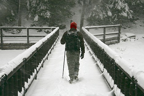 &lt;p&gt;Luke Stocker of Coeur d'Alene crosses a bridge over McDonald Creek on a winter trip to Glacier National Park.&lt;/p&gt;