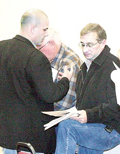 &lt;p&gt;State Sen. Chas Vincent, left, confers with State Rep. Jerry Bennett, right, during the water-rights meeting as State Rep. Mike Cuffe, center, listens in.&lt;/p&gt;