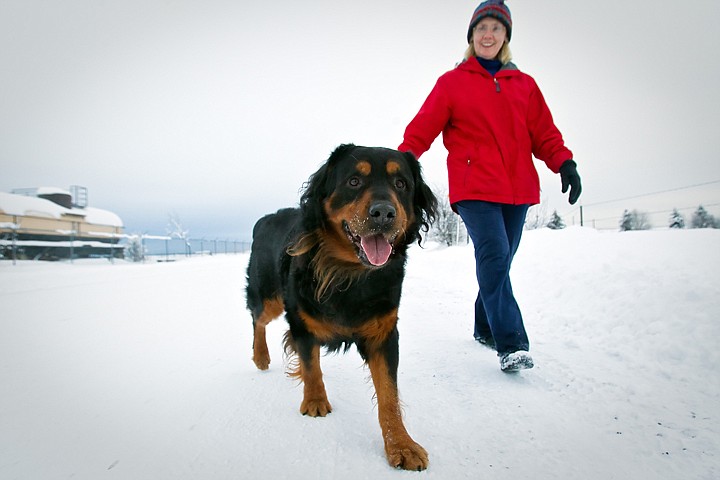 &lt;p&gt;Paula Dahlen, a volunteer with the Kootenai Humane Society, walks one of the shelter dogs Monday.&lt;/p&gt;