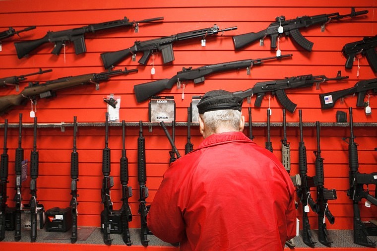 &lt;p&gt;A customer browses the wall of AR-type rifles at Frontier Guns and Ammo in Evergreen. Tuesday, Nov. 20, 2012 in Kalispell, Montana.&lt;/p&gt;