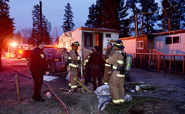&lt;p&gt;Members of the Evergreen Fire Department and the Flathead County Sheriff's Department gather around the scene of a camper fire on Tuesday morning, November 27, in Evergreen. The Kalispell Fire Department was also called to the scene. The camper was occupied.&lt;/p&gt;