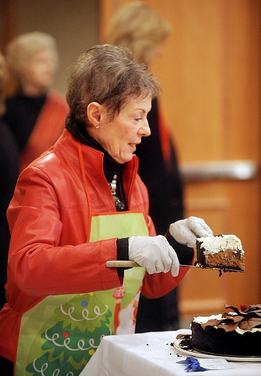 Barbara Hall of Lakeside serves up a slice of Chocolate Mousse Elegance by Kerrin McCormick. McCormick won Best of Show in the amateur category.