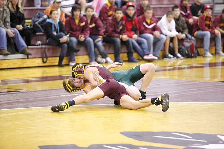 Beau Gleed (126) turns his opponent over and puts him on the mat
to win by a pin. The Chiefs beat the Richland Bombers at Moses Lake
High School last night to in the first match of the regular
season.