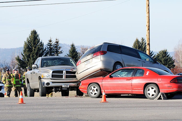 &lt;p&gt;Firefighters investigate a three-vehicle crash Tuesday morning at the intersection of Northridge Drive and U.S. 93 in Kalispell. No one was injured.&lt;/p&gt;