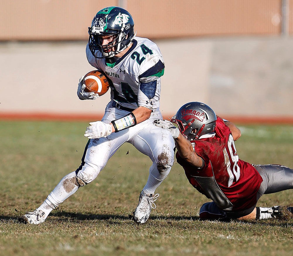 &lt;p&gt;Glaciers Caleb Jones breaks tackles and runs for a first down during the Wolfpack's 23-13 win over Helena High at Vigilante Stadium on Nov. 7, 2015. (Gary Marshall/BMGphotos.com)&lt;/p&gt;