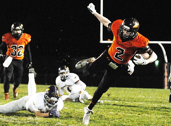 &lt;p&gt;Flathead's Seth Adolph breaks a tackle as he carries the ball for a first down during the Braves' opening, scoring-drive against Missoula Sentinel at Legends Stadium on Oct. 30, 2015. (Aaric Bryan/Daily Inter Lake)&lt;/p&gt;