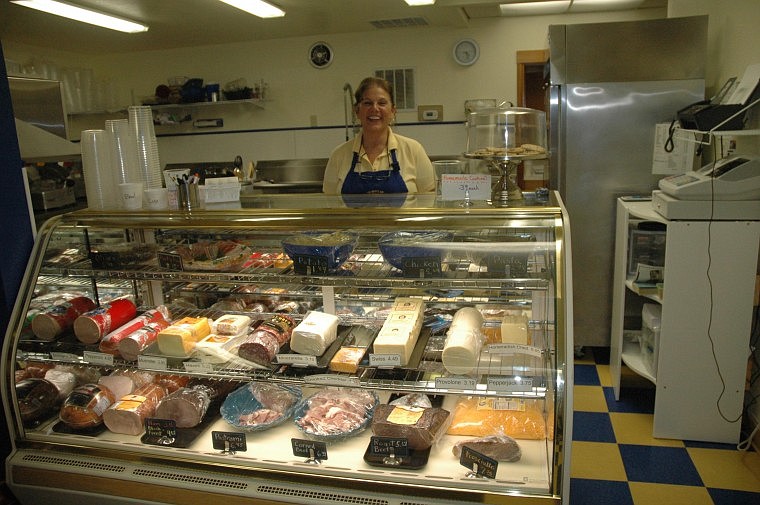 &#151;Photo by JULIE GOLDER Michele Gagnon presents the deli window at Far North Deli.