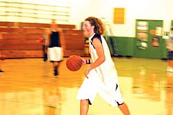 Keenan Ewalt heads for the basket as he dribbles the ball down court.