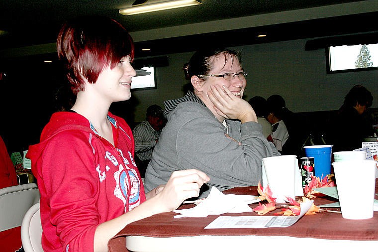 &lt;p&gt;Marlee Logan and Angela Wright share a laugh while having Thanksgiving dinner at the St. Regis Community Center.&lt;/p&gt;