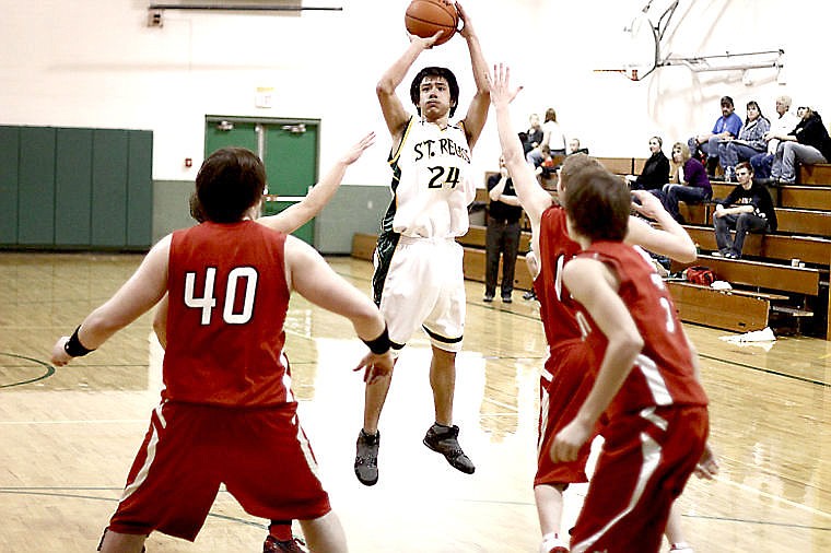 &lt;p&gt;A St. Regis player takes a jump shot at a home game last season.&lt;/p&gt;