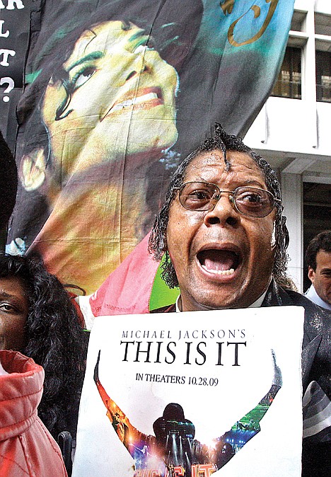 <p>A man shouts with joy after hearing the sentencing of Dr. Conrad Murray, the doctor convicted in the overdose death of singer Michael Jackson, at the Los Angeles Criminal Justice Center in Los Angeles, Tuesday.</p>