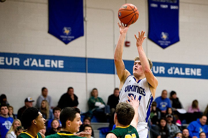 &lt;p&gt;Coeur d'Alene's Joey Naccarato goes for a three-pointer, shooting past three Shadle Park players on Thursday at Coeur d'Alene High School. The Vikings defeated the Highlanders 45-44.&lt;/p&gt;