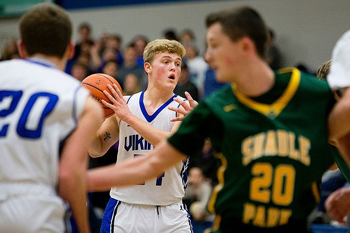 &lt;p&gt;Coeur d'Alene's Joey Naccarato looks for an open teammate to pass to during a match-up against Shadle Park on Thursday at Coeur d'Alene High School. The Vikings defeated the Highlanders 45-44.&lt;/p&gt;