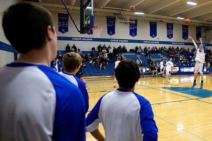 &lt;p&gt;Coeur d'Alene players practice their jumpshots before a match-up against Shadle Park on Thursday at Coeur d'Alene High School. The Vikings defeated the Highlanders 45-44.&lt;/p&gt;