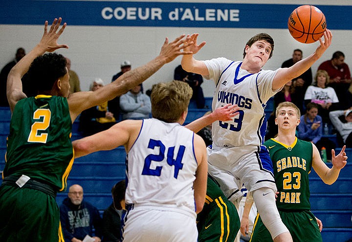&lt;p&gt;Coeur d'Alene's Will McElver reaches for a rebound during the first half of a match-up against Shadle Park on Thursday at Coeur d'Alene High School.&lt;/p&gt;