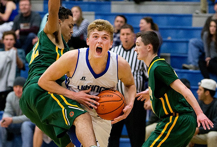 &lt;p&gt;Coeur d'Alene's Joey Naccarato drives past Shadle Park's Kobe Reese, left, and Kylan Kelley on Thursday at Coeur d'Alene High School.&lt;/p&gt;