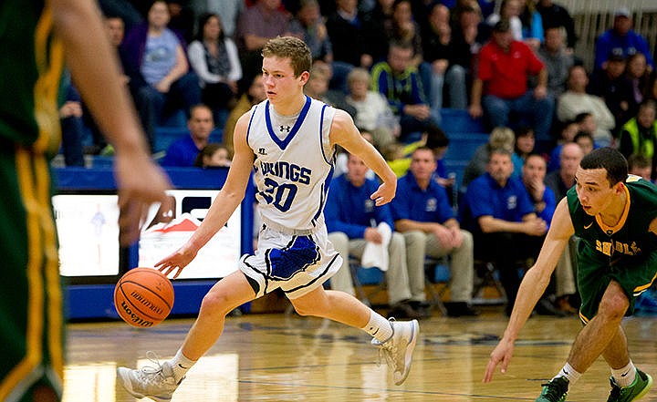 &lt;p&gt;Coeur d'Alene's Sam Matheson dribbles up the court during a face-off against Shadle Park on Thursday at Coeur d'Alene High School. The Vikings defeated the Highlanders 45-44.&lt;/p&gt;