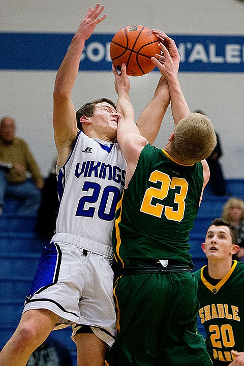 &lt;p&gt;Coeur d'Alene's Sam Matheson (20) fights for a rebound with Shadle Park's Cole Riblet on Thursday at Coeur d'Alene High School. The Vikings defeated the Highlanders 45-44.&lt;/p&gt;