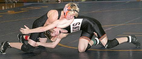 Photo by Sarah Leavenworth&lt;br&gt;Savage Horseman Kenneth Beech withstands a surge from Eureka Lion Eric Roe during a &quot;mixer&quot; Friday, featuring competition between Plains-Hot Springs, Thompson Falls and Eureka. Beech delivered a standout performance for Plains-Hot Springs, pinning Roe in 1:14 and Bluehawk Darrick Brawn in 2:41 for a pair of wins.