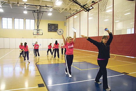 &lt;p&gt;Melissa Boyer, 15, of Post Falls, follows dance coach Andrea Goad of Rathdrum during a practice Sunday in the Kroc Center. A dozen Dance Theatre Northwest dancers will be performing in parades in Disneyland and Disney California Adventure theme parks Dec. 12 and 13.&lt;/p&gt;