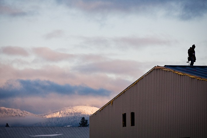 &lt;p&gt;Rene Martinez, a roofer with Forge Builders, pauses for a moment during construction on a pole building Friday at LA Aluminum and Castings in Hayden. The building is part of a $1 million project.&lt;/p&gt;