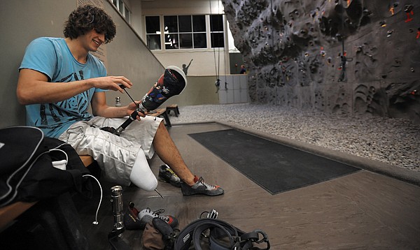 &lt;p&gt;Ian Reynolds, 24, adjusts his prosthetic leg before climbing the
wall at The Summit on Thursday night in Kalispell. The Whitefish
native chose to have his foot amputated after injuries from a
sparkler bomb accident left him with drop foot.&lt;/p&gt;